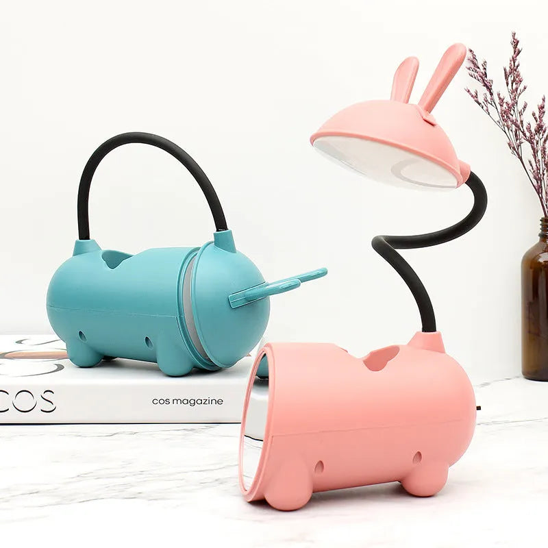 Cartoon-themed desktop table lamp with integrated pen container in green colour
