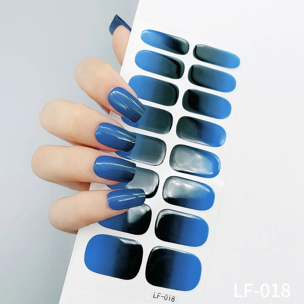 16 solid colour full nail art stickers with 22 patterns including cross, rose, butterfly designs in 12x6mm oval size