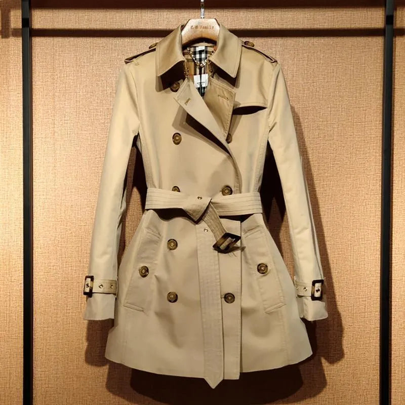 Khaki double-breasted trench coat for women with long flight sleeves, shown on a hanger.