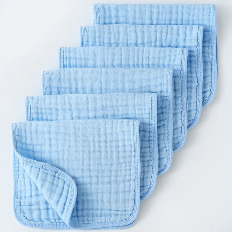 Set of six large muslin burp cloths 25x50cm in assorted colours on white background