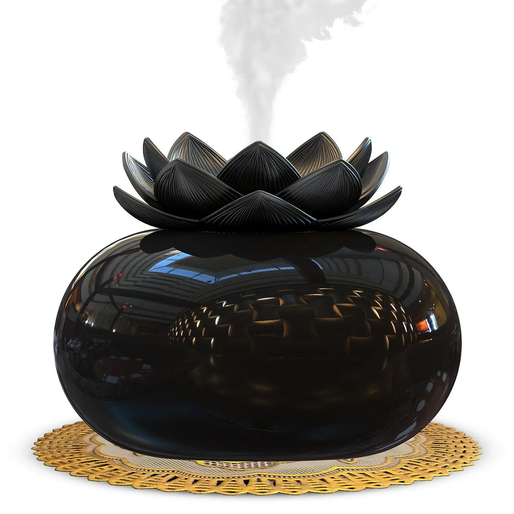 Pure black round Lotus aromatherapy ultrasonic humidifier with USB cable on a desk.