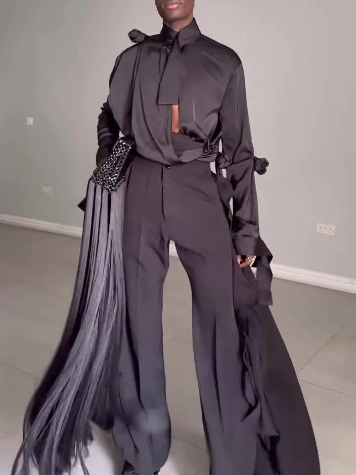 Men's black hollow cut out shirt and high waist pants suit set on display, polyester fabric, regular fit