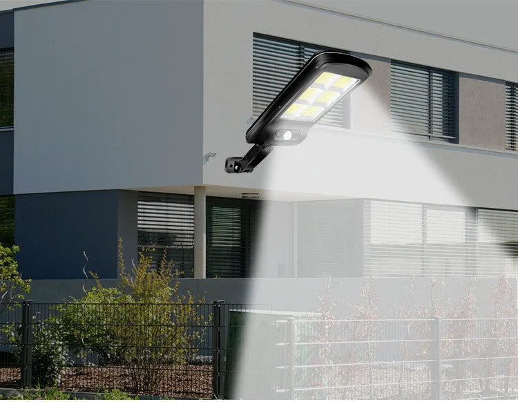 Black solar-powered outdoor motion sensor light with solar panel
