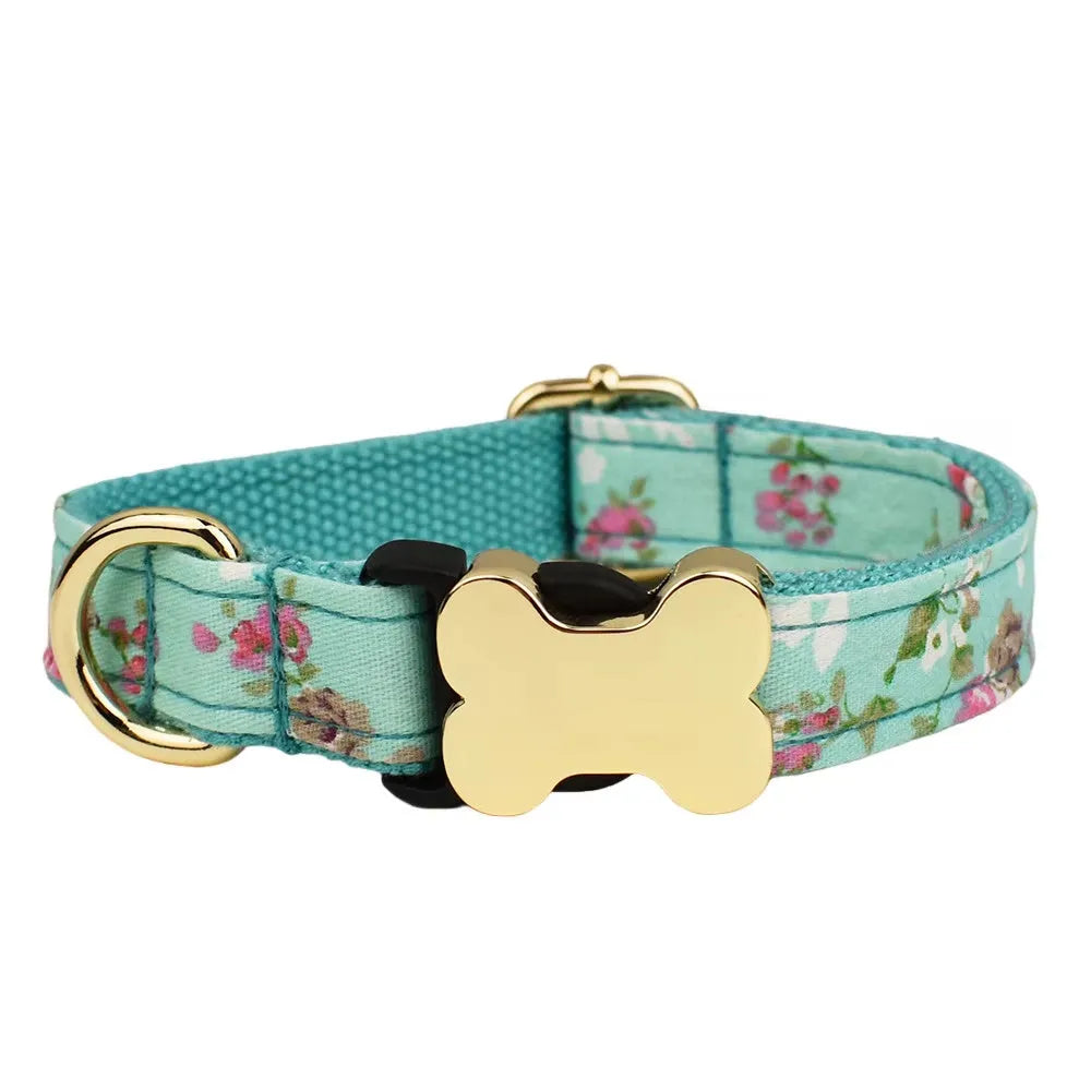 Flat nylon dog collar with a printed grid design and a bone-shaped metal buckle in assorted colours.