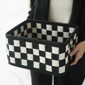 Grey and white checkerboard woven felt storage basket with folded sides, showing dimensions of 37cm by 29cm.