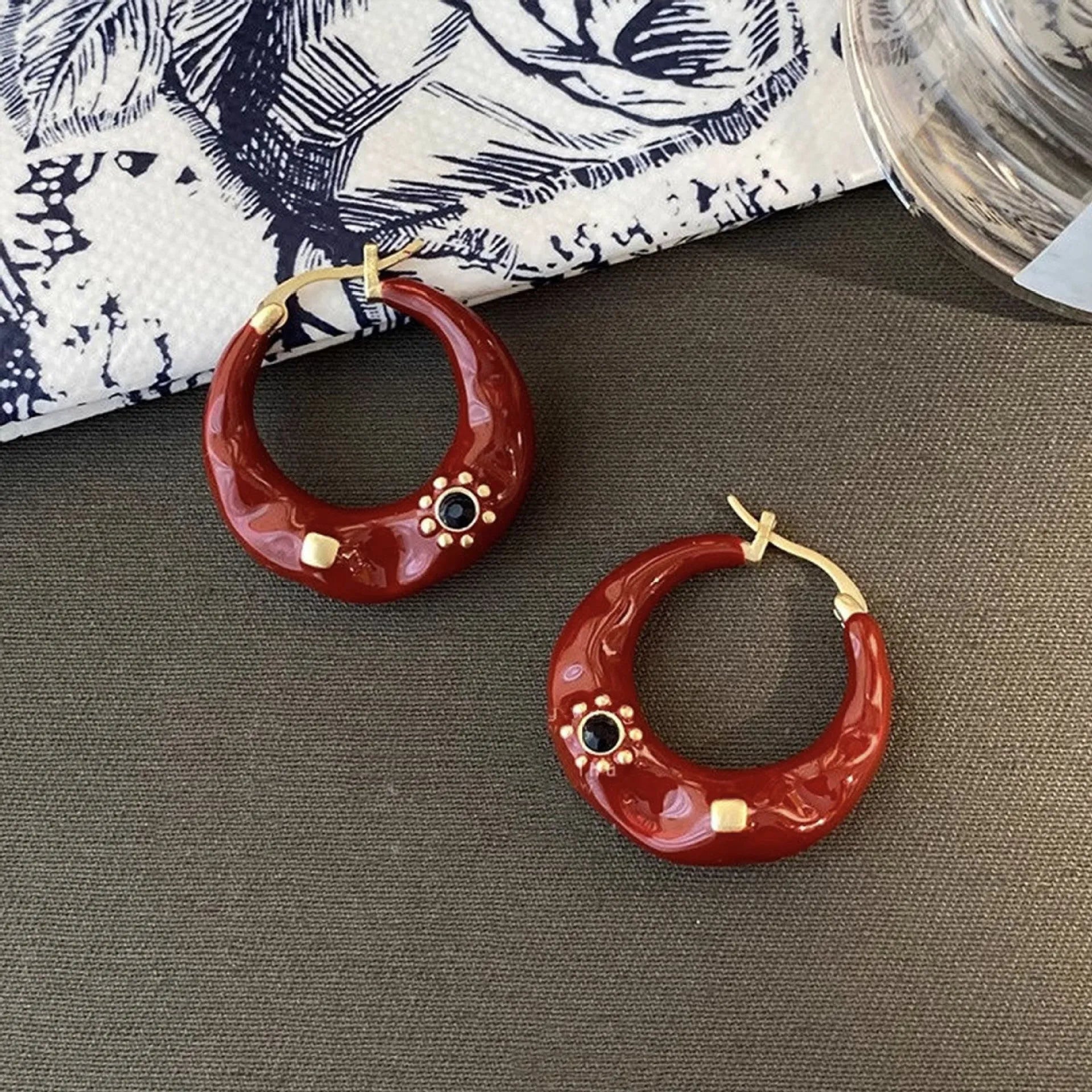 Hong Kong style retro ear studs with rhinestone inlay and dripping oil finish in black and red colours