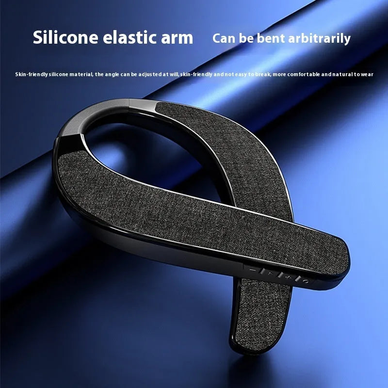 Black neck-mounted stereo wireless Bluetooth speaker with USB charging cable on neutral background