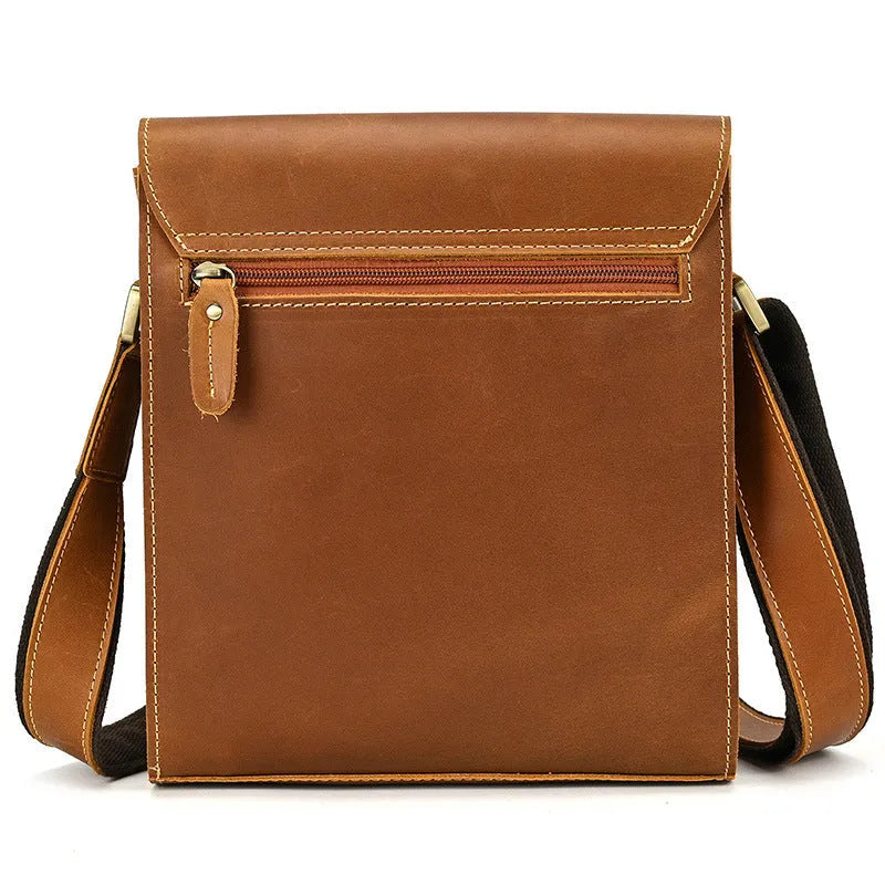 Men's brown leather shoulder bag with flip shoulder strap showing sewing line details and retro design