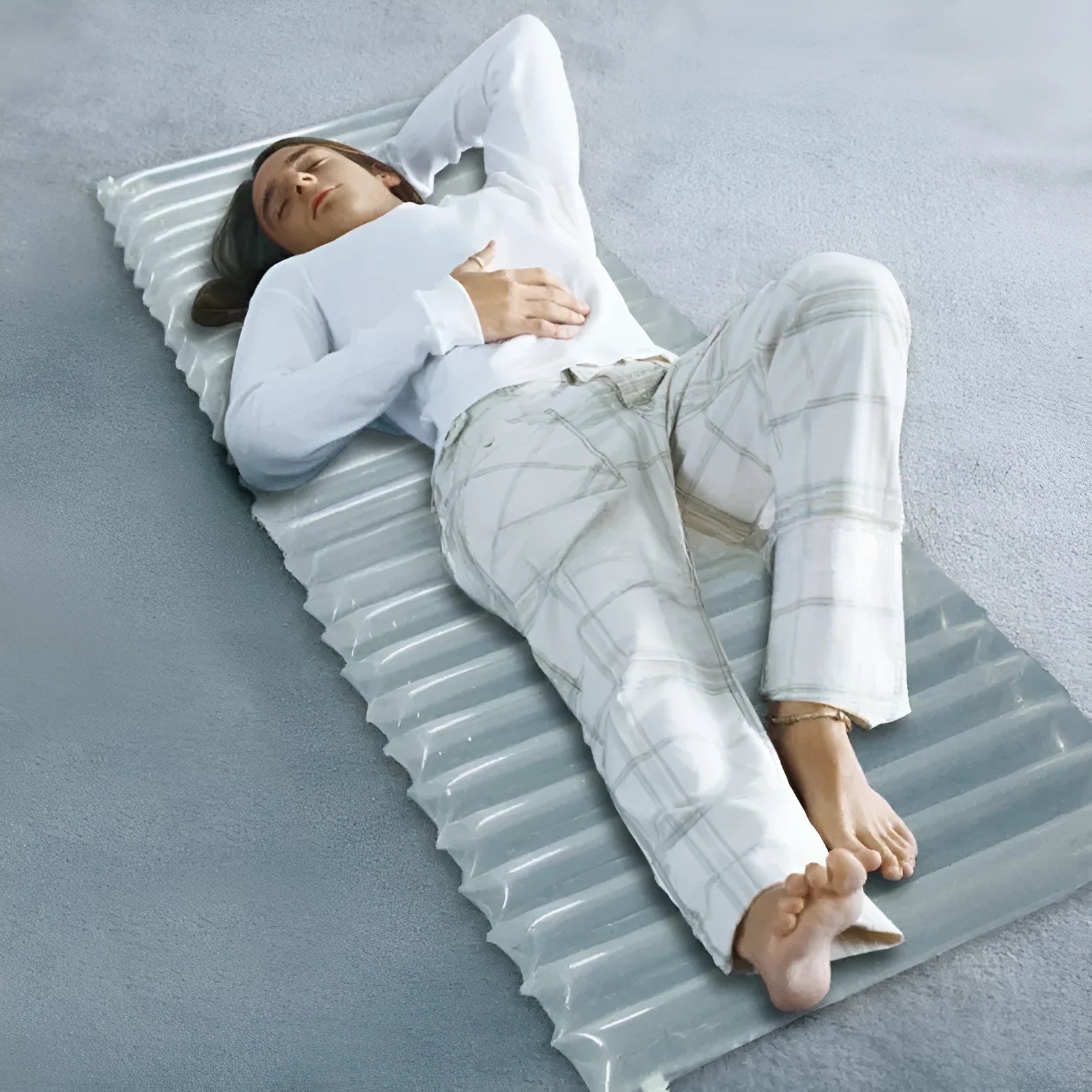 Transparent outdoor inflatable airbed measuring 200cm long by 60cm wide.