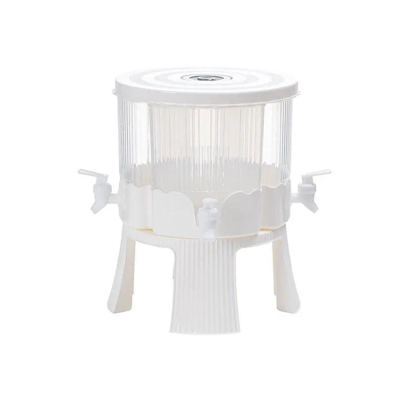 Rotating refrigerator cold water kettle with faucet and glacier pattern finish on kitchen counter