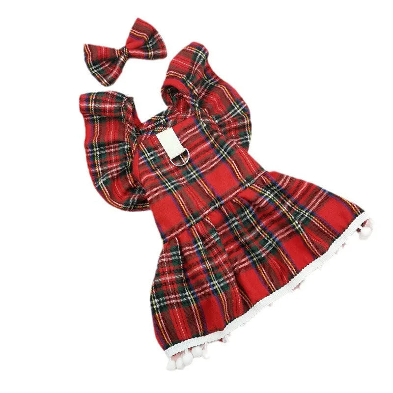 Red tartan Christmas skirt outfit with bow tie and head flower on a cat
