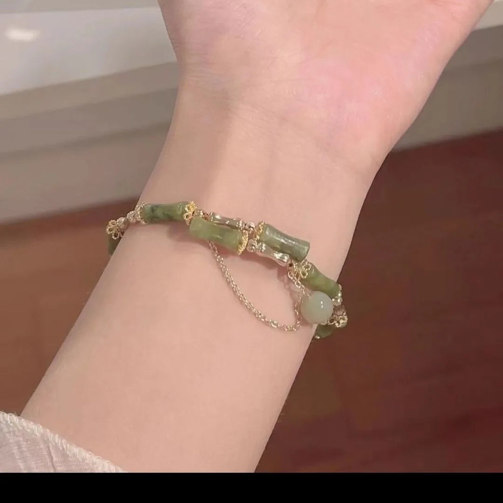 Women's plum wine coloured glaze bracelet with bamboo joint design and glossy baking varnish finish.