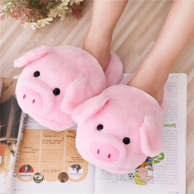 Pink pig character plush floor slippers on a white background