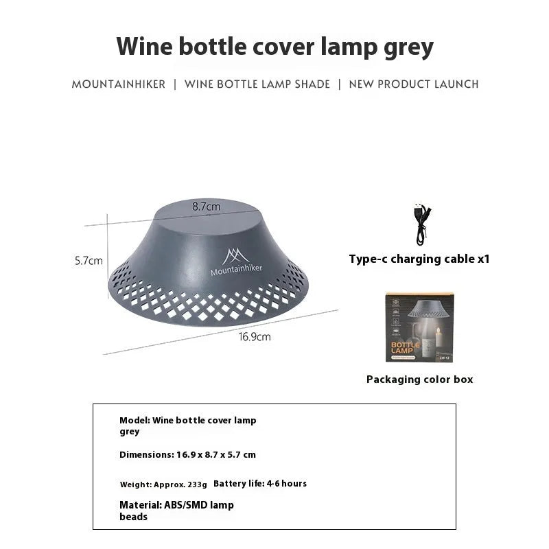 Beige plastic camping lantern shaped like a wine bottle with a glowing LED light inside on a wooden surface.