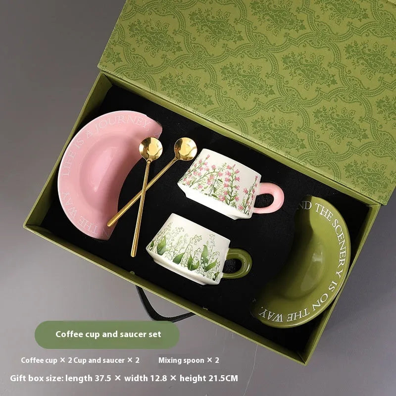 Ceramic coffee cup set with two 300ml cups, matching saucers, and stirring spoons