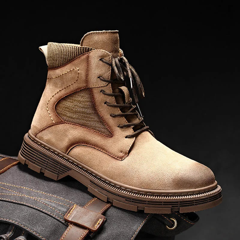 Men's brown frosted leather Martin boots with thick rubber sole on a wooden floor.