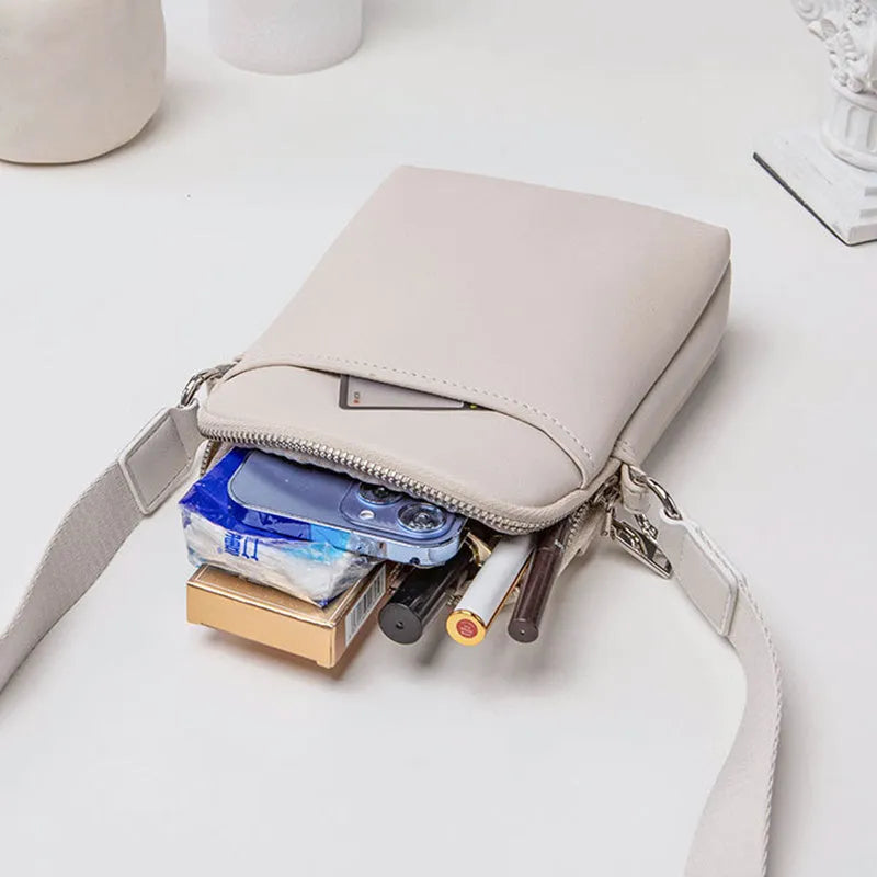 Solid colour women's PU crossbody phone bag shown in beige, displaying front view.