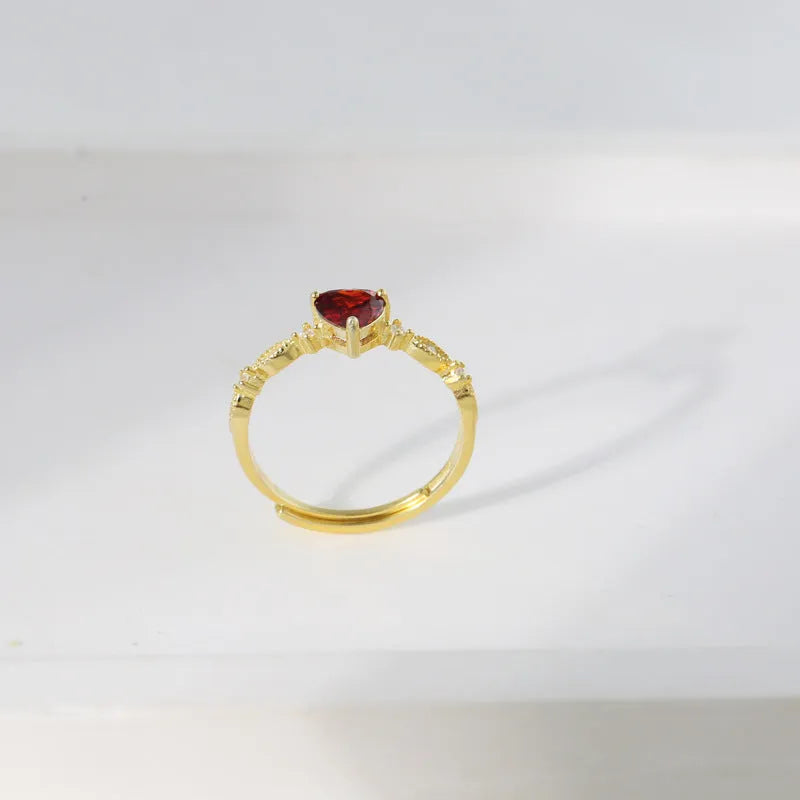 Red zirconium heart-shaped ring in yellow gold electroplated silver with adjustable open band