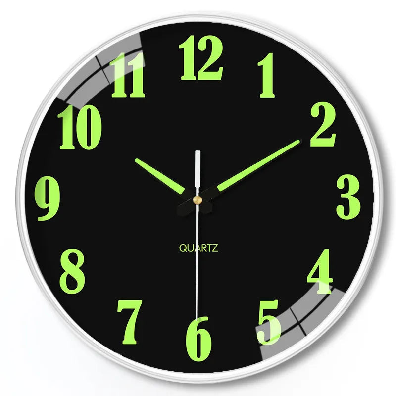 Modern 8 inch circular wall clock with luminous numerals on a white wall