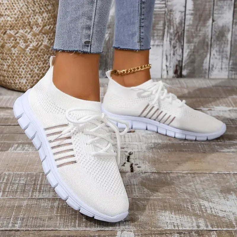 Women's casual breathable mesh sports flat shoes with front tie closure and EVA sole