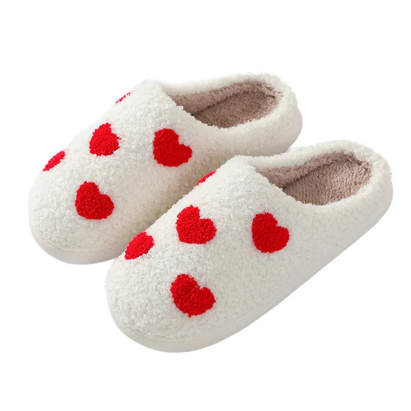 Women's plush home slipper with cartoon graphic print and non-slip PVC sole.