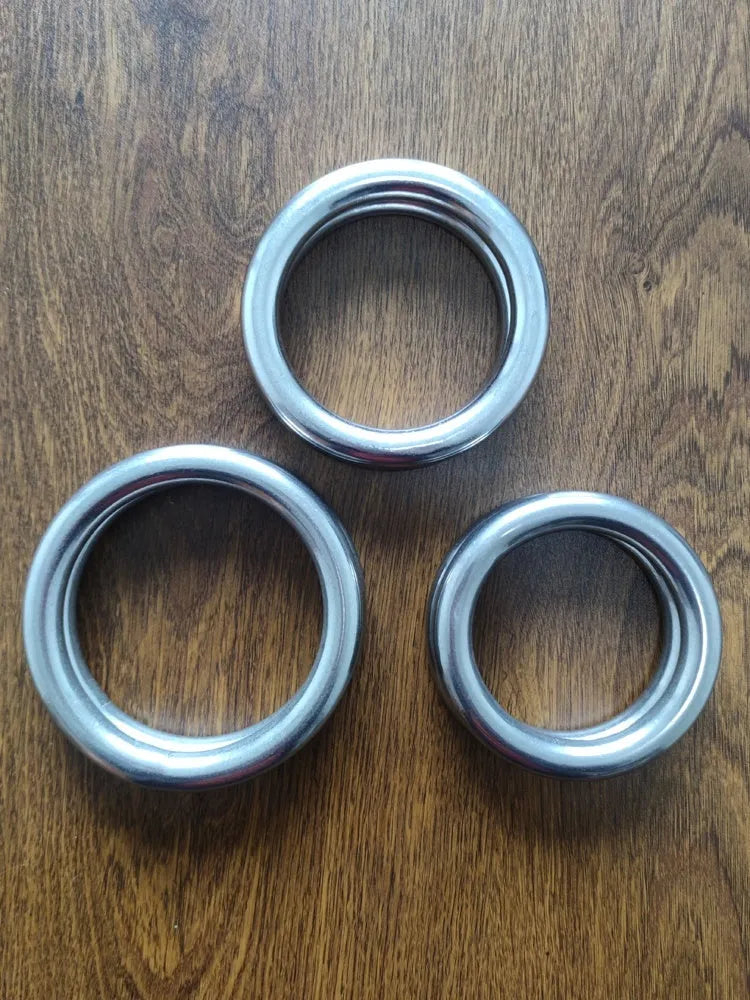 A silver carbon steel ring for Wing Chun iron arm and hand grip strength training.