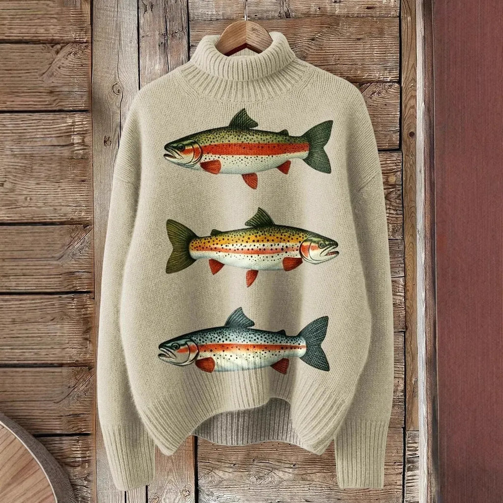 A woman's loose-fit Christmas sweater with a painted festive print, a turtleneck, and long sleeves in a soft macaron colour.