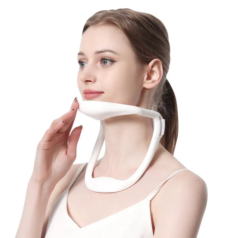 White adjustable neck support brace for cervical spine and shoulder posture correction.