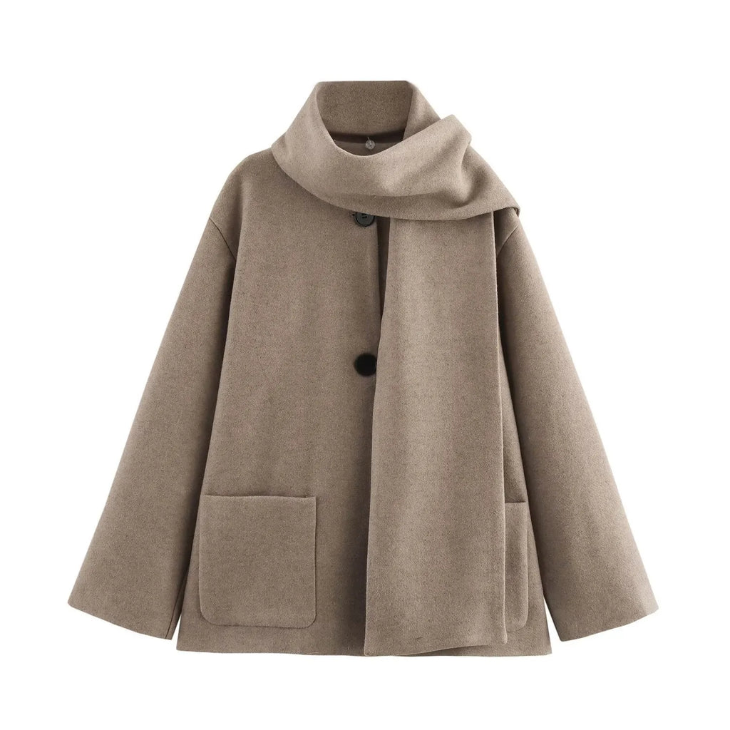 Women's long black polyester overcoat with a fluffy artificial fur collar, shown on a hanger.