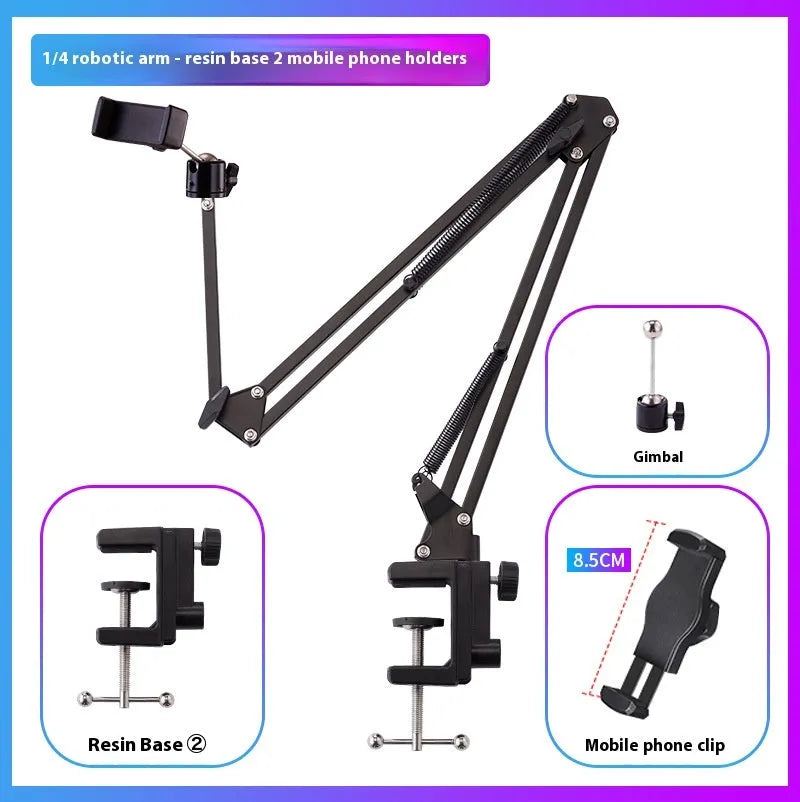 Black foldable metal desktop cantilever bracket holding a tablet, showing adjustable arm and clip.