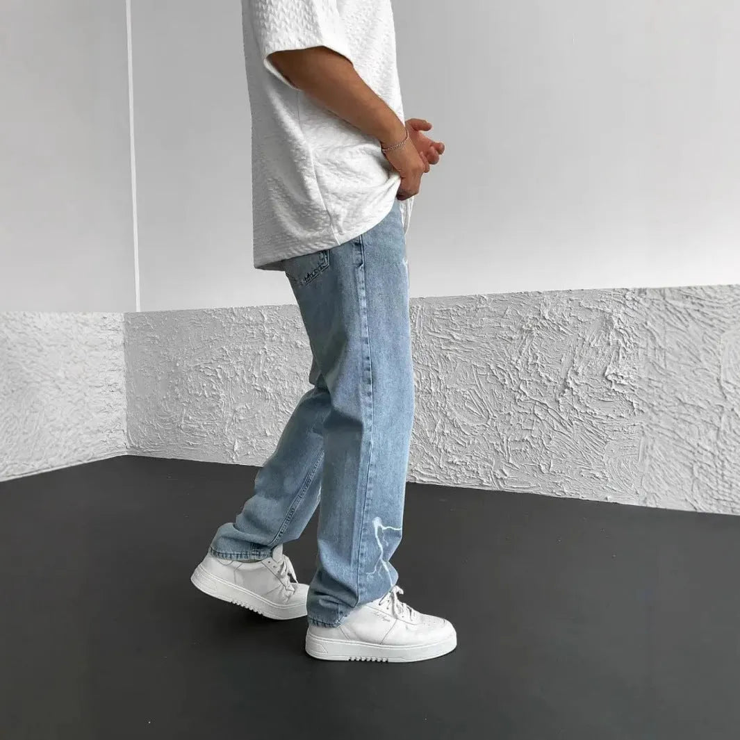 Men's blue straight-leg jeans with loose wide-leg fit and mid-rise waist