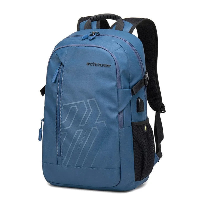 Blue plaid 18 inch laptop backpack with curved shoulder strap showing front pocket.