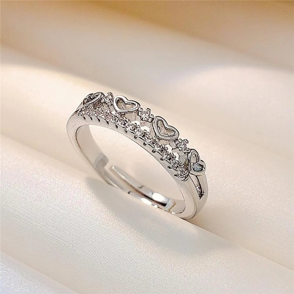 Adjustable open ring in gold or silver with double layer heart, crown and star design on copper band