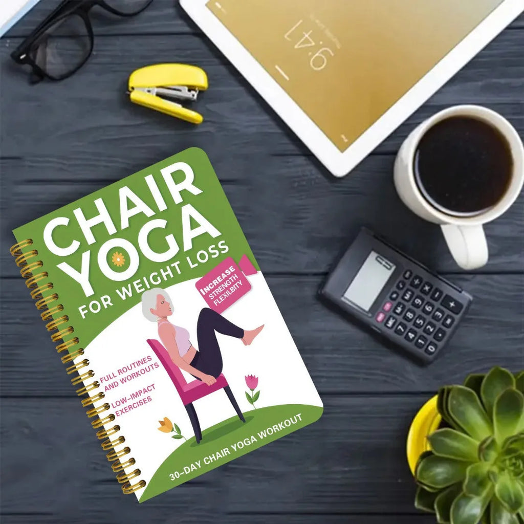 Green coil-bound yoga training notebook showing 30-day calendar pages and yoga programme content