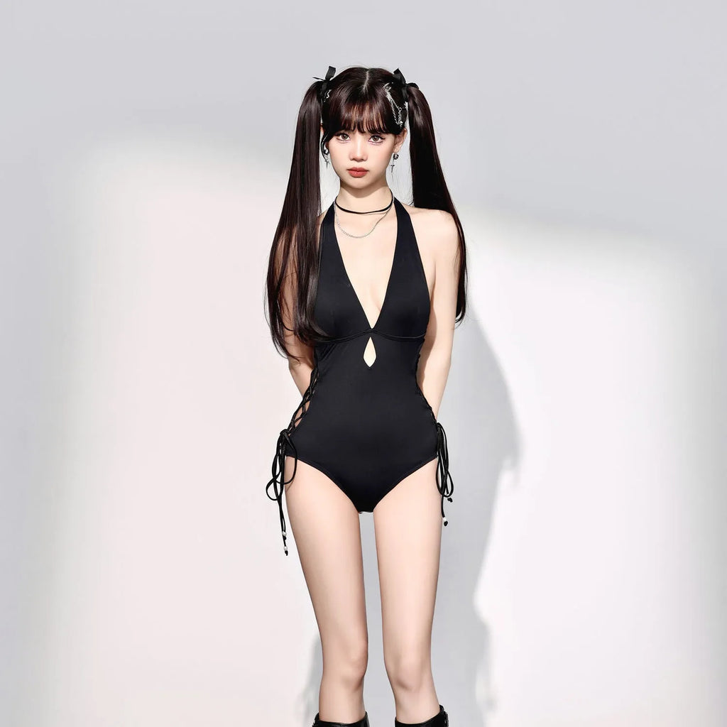 Black women's one-piece swimsuit with V-neck and hollow strap detail.