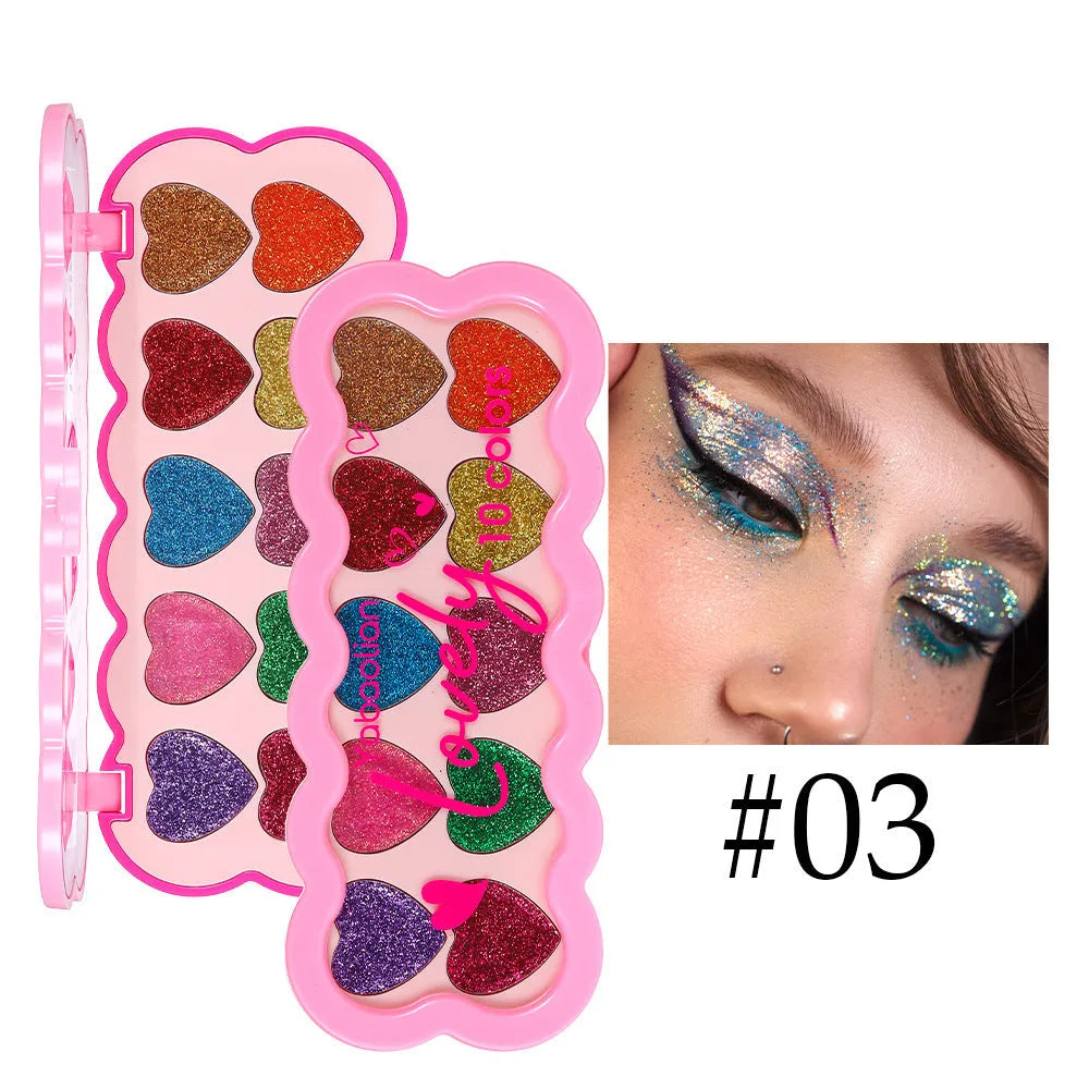 Pearlescent Heart ten-color sequins eye shadow palette showing shades of white, beige, pink, purple, brown, blue, black, royal blue, maroon, and coral.