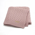 Solid colour infant hug blanket with three-dimensional lines pattern in acrylic fabric.
