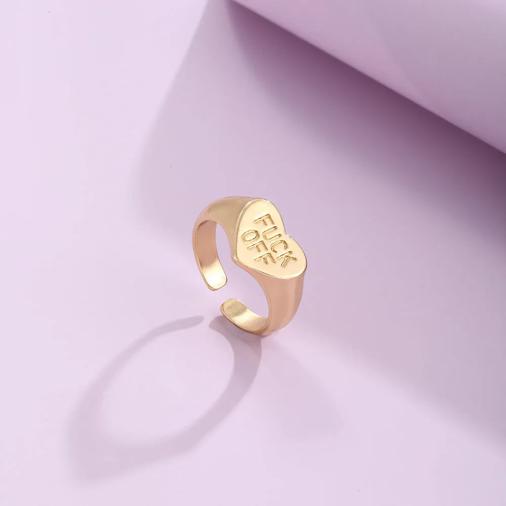 Vintage alloy ring set of four with heart shapes and letter cutouts, electroplated finish, colour JH1084