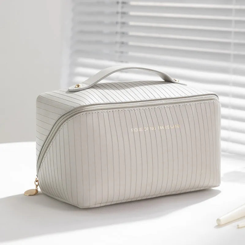 Vertical pattern pillow makeup bag in cubic shape with PU material, shown in available colours.