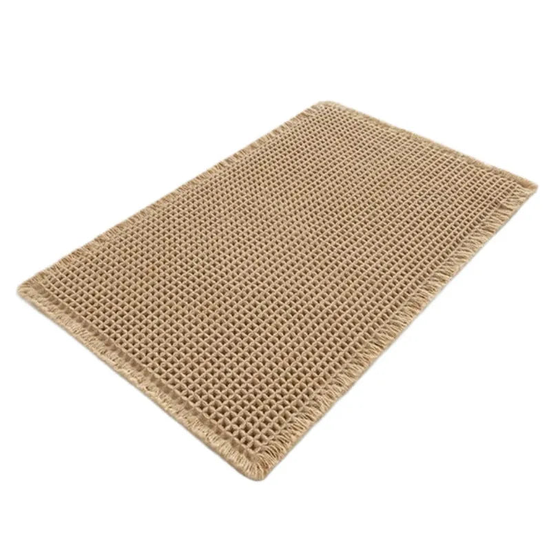 Beige checkered non-slip bathroom carpet mat on tiled floor.