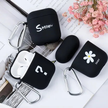 Polycarbonate AirPods case cover with floral and emoticon decorative designs in black and pink colour options