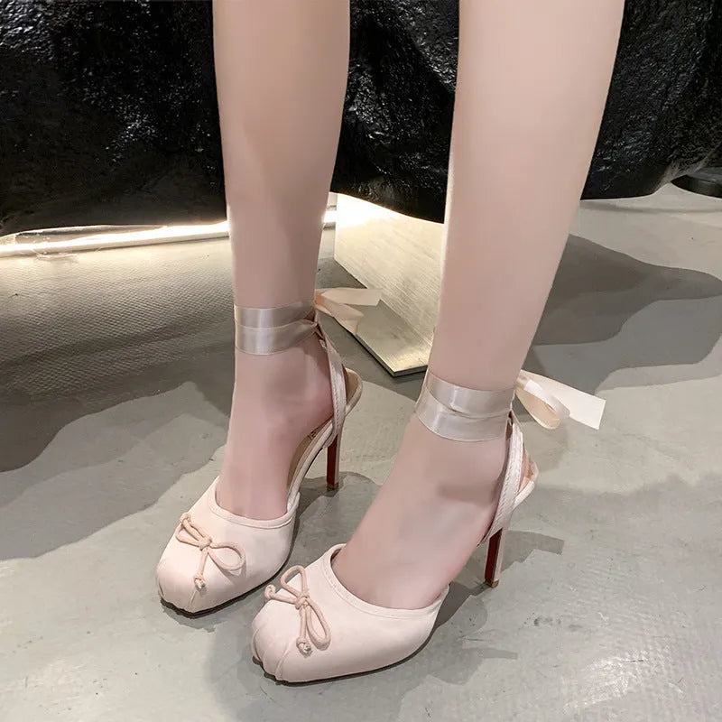 Women's satin high heel sandals with cross strap, round toe, and 6-8cm stiletto heel in black or pink
