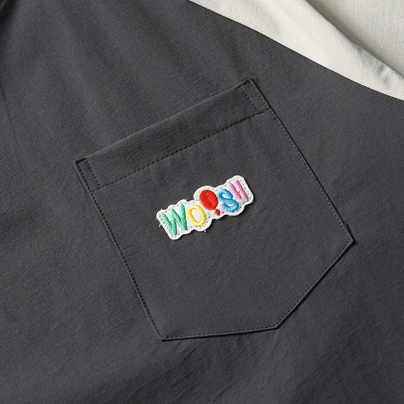 Dark grey loose fit t-shirt with raglan sleeves and contrast colour details.