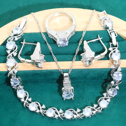 Bridal zircon jewellery four-piece set showing necklace, bracelet, earrings, and ring with water wave chain styling
