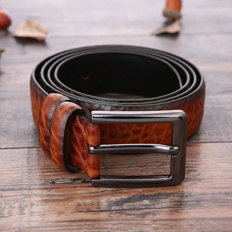 Men's business belt with laser logo detail, alloy pin buckle, and imitation leather strap showing pattern design options