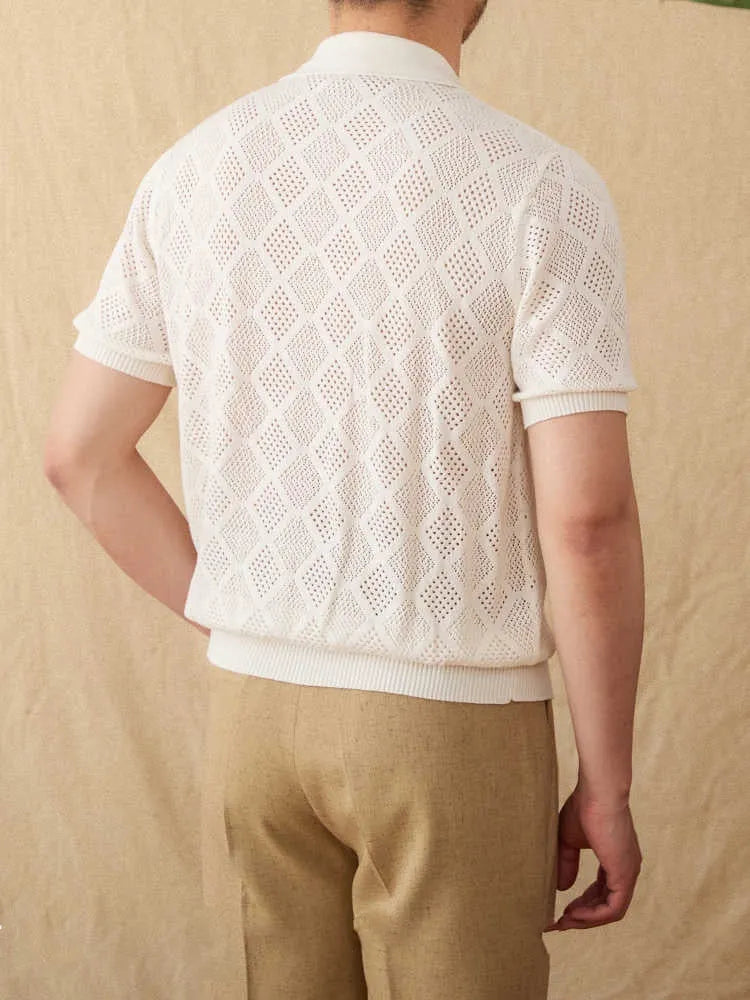 Light brown cotton zip-front cardigan with short sleeves and a lapel collar on a hanger.