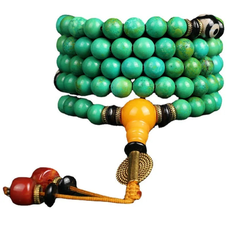 Natural turquoise bracelet with 108 round 8mm beads on a white background.