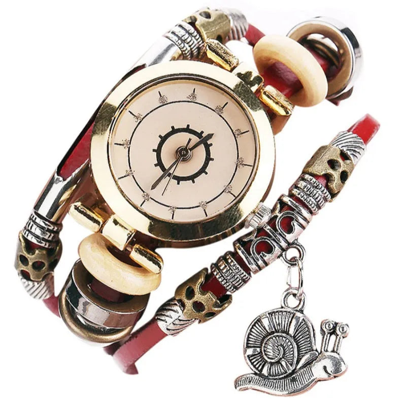 Women's vintage bracelet watch with coiling leather strap and snail pendant in Mori style