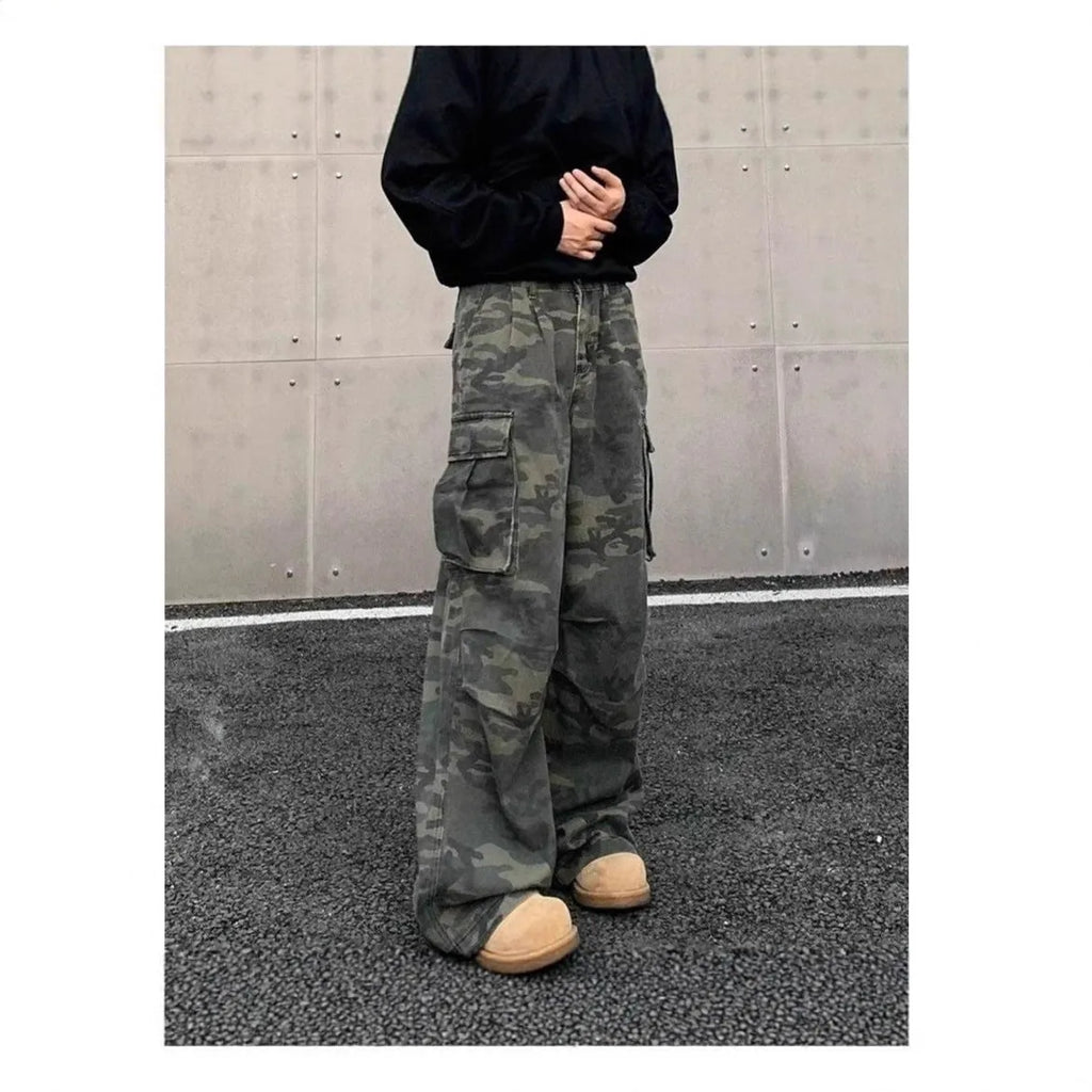 Men's washed camouflage print cargo trousers with multiple pockets and a mid waist design.