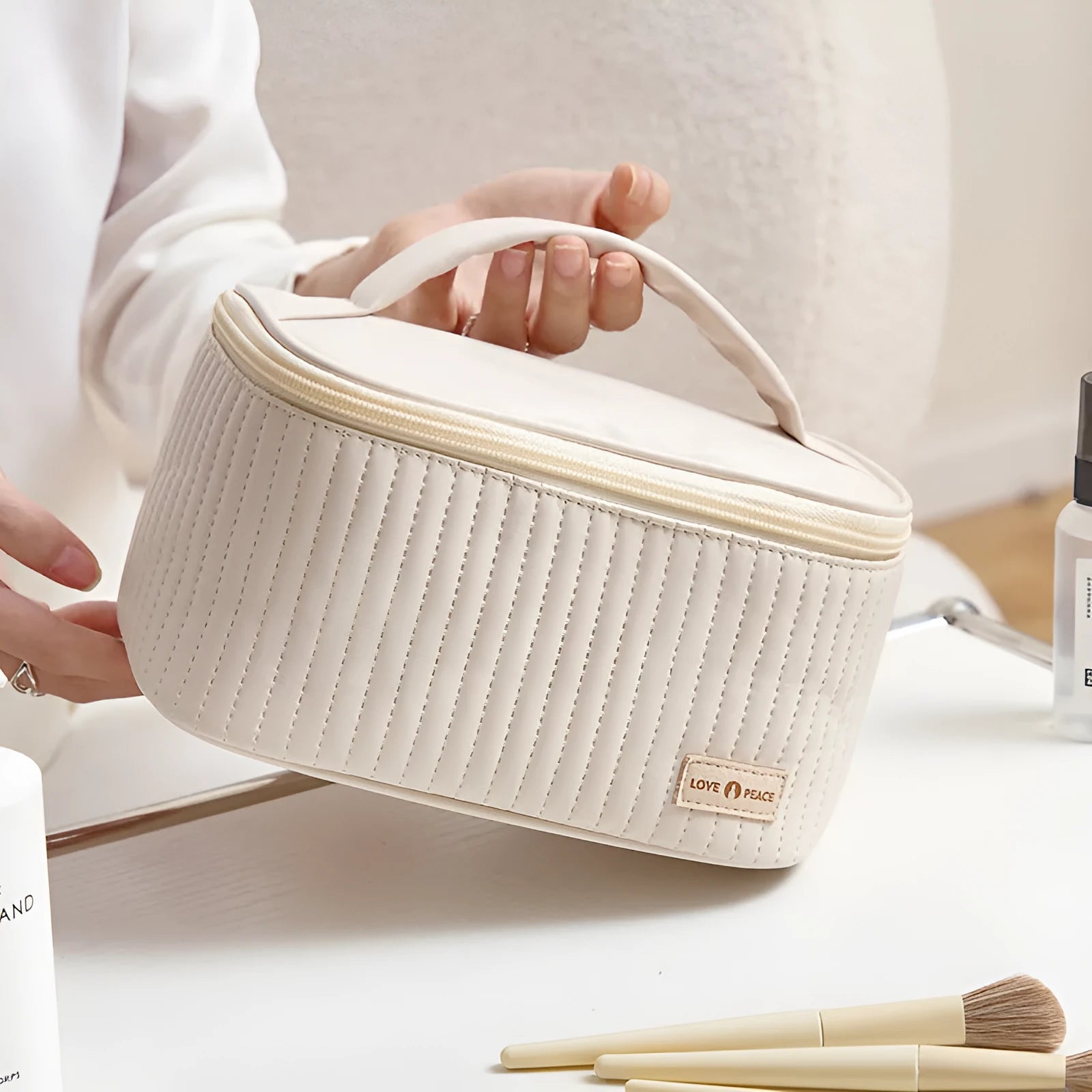 Open-top cake style makeup bag in PU leather showing solid colour options including pink and beige.